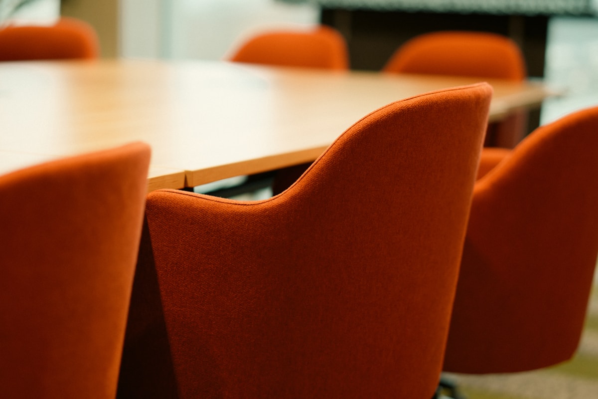 Modern conference room table with chairs in a professional office setting