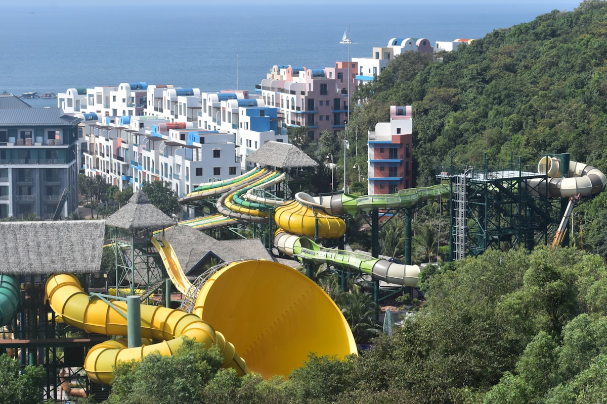 Colorful indoor water park with multiple slides and pool areas