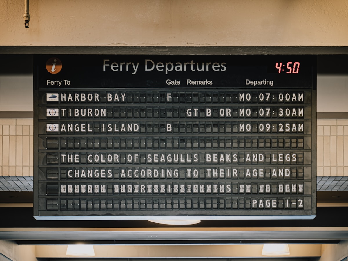 Ferry departures board showing times and destinations, similar to airport flight boards