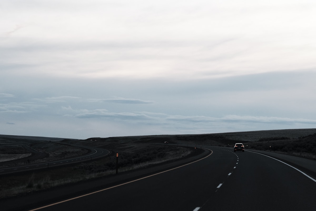 Open interstate highway with wide lanes under clear skies