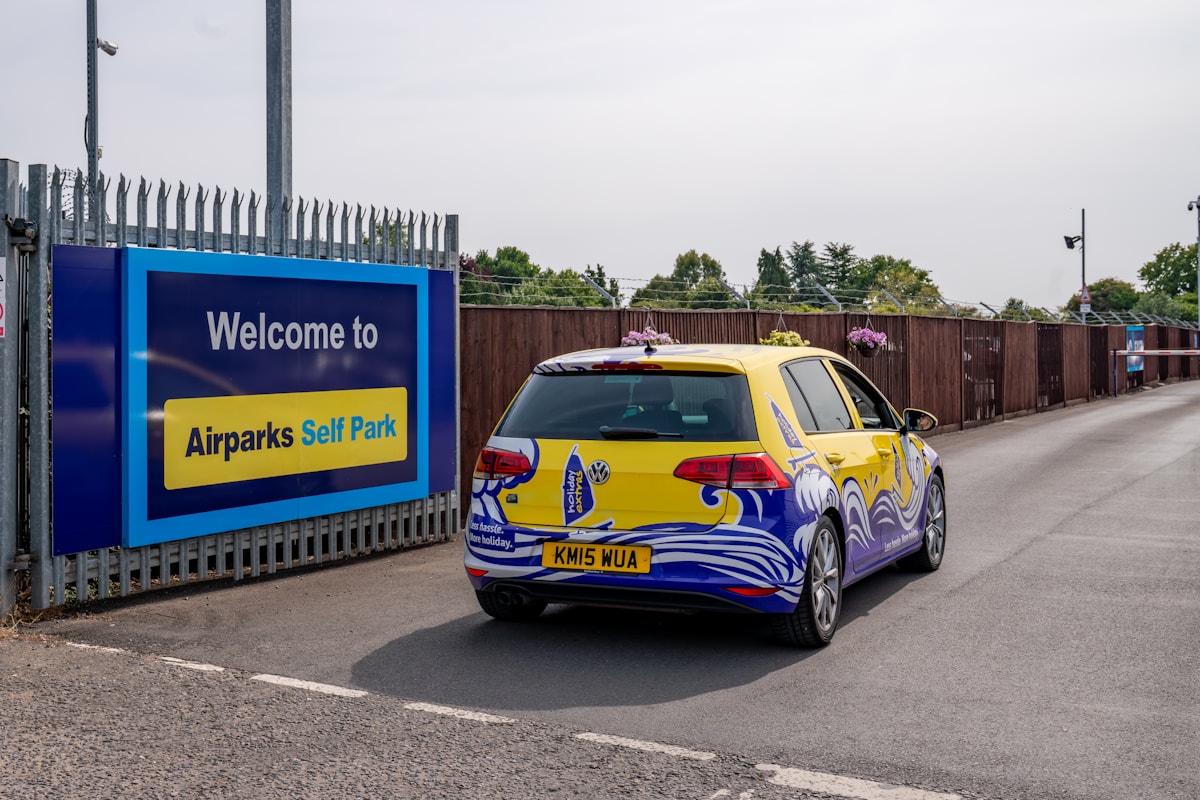 Car arriving at airport car park entrance for curbside pickup