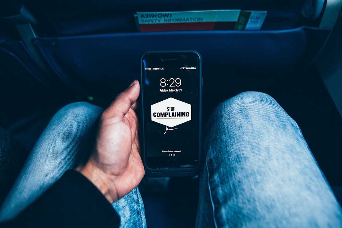 Person holding smartphone with a rideshare navigation app open